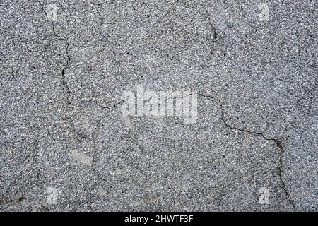 surface of concrete gray wall  in cracks Stock Photo