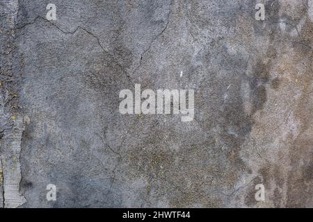surface of concrete gray wall  in cracks Stock Photo