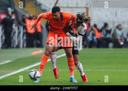 ISTANBUL, TURKEY - MARCH 7: Trezeguet of Istanbul Basaksehir FK and Valentin Rosier of Besiktas JK battle for possession during the Turkish Super Lig match between Besiktas JK and Istanbul Basaksehir FK at Vodafone Park on March 7, 2022 in Istanbul, Turkey (Photo by Orange Pictures) Stock Photo