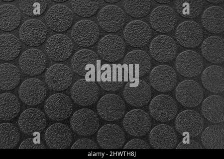 Black textured vinyl background. Dot pattern. Full frame Stock Photo