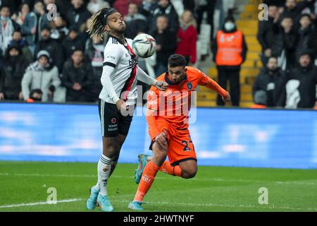 ISTANBUL, TURKEY - MARCH 7: Valentin Rosier of Besiktas JK is challenged by Trezeguet of Istanbul Basaksehir FK during the Turkish Super Lig match between Besiktas JK and Istanbul Basaksehir FK at Vodafone Park on March 7, 2022 in Istanbul, Turkey (Photo by Orange Pictures) Stock Photo