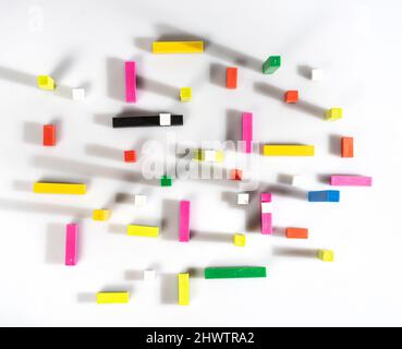 top view of colored cubes and bars on a white surface Stock Photo