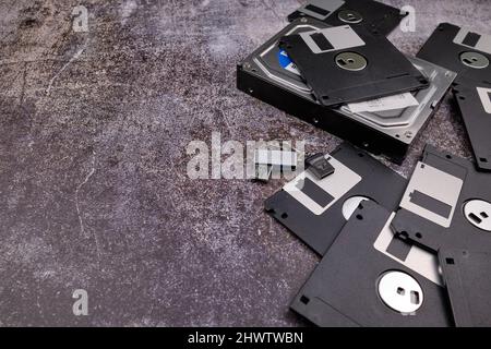 Technological background formed by different components of a computer on a table with a color similar to cement and with empty space. Stock Photo