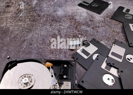 Technological background formed by different components of a computer on a table with a color similar to cement and with empty space. Stock Photo