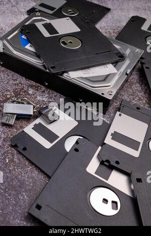 Composition of various computer components on a dark background similar to cement. Stock Photo