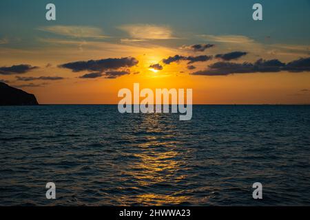 Sunset over the sea. Afterlife concept photo. Seascape with clouds on the sky at sunset. Stock Photo