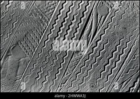 Tires tracks in sand at beach Stock Photo