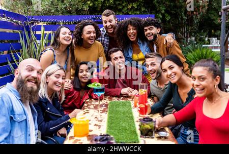 United international group of young student friends having fun drinking together Stock Photo