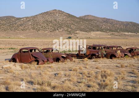 Old rusted cars in the desert area Stock Photo - Alamy