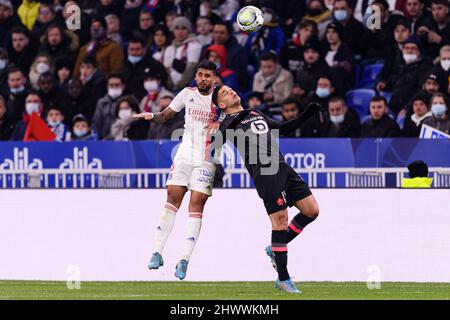 Lyon, France - February 27: Emerson Palmieri of Lyon (L) fights for the ball with Hatem Ben Arfa of Lille (R) during the Ligue 1 Uber Eats match betwe Stock Photo