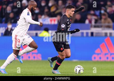 Lyon, France - February 27: Hatem Ben Arfa of Lille (R) is chased by Moussa Dembele of Lyon (L) during the Ligue 1 Uber Eats match between Olympique L Stock Photo