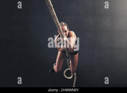 Young athletic women in tight sports clothes taking up Side Plank Pose on  gym floor with rubber mats during yoga practice. Active slim ladies  building overall flexibility using Vasisthasana exercise Stock Photo 