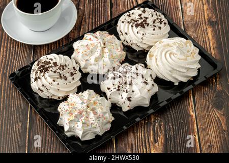 meringue cookies or beze cookies with candy and chocolate Stock Photo