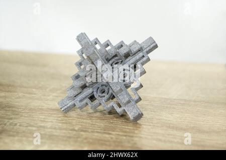 Gray abstract models printed on 3d printer from powder close-up. Stock Photo