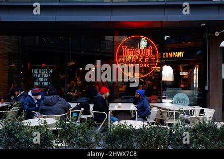 People in the outdoor cafe seating area at Time Out Market New York, 55 Water St, Brooklyn, NY. a food hall in the Dumbo neighborhood. Stock Photo