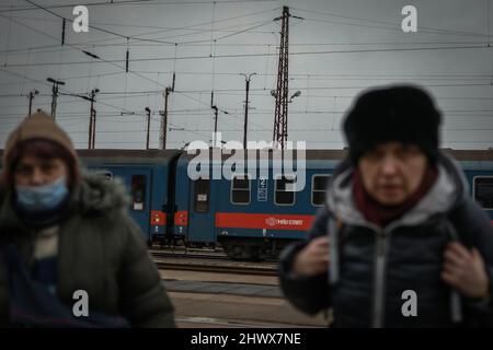 Zahony, Hungary - March 7, 2022: refugees from Ukraine arrive at the Zahony border train station after Russia launched a full-scale military operation in the country Stock Photo