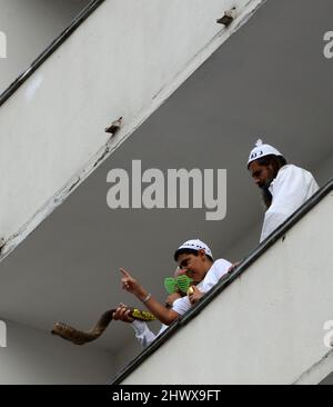 A Jewish man blowing the shofar during the Rosh Hashana / Jewish New Year holiday in Uman, Ukraine. Stock Photo