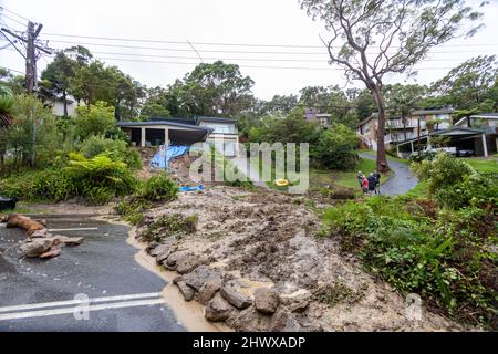 Bilgola Plateau in Sydney, landslide caused by heavy rain and storms flows from a homeowners garden and completely blocks a local road as residents await emergency services. Credit Martin Berry @alamy live news.Tuesday 8th March 2022. Stock Photo