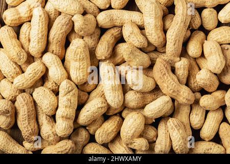 Close up peanuts or groundnuts pattern. Peanuts in the shell Stock Photo