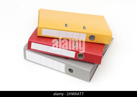 Yellow, gray and red office folder on white background. Stock Photo