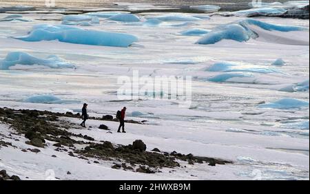 Icebergs, some bigger than the size of houses sit frozen on the Fjallsarlon glacier lake at the south end of the Vatnajokull ice cap in Iceland. Picture date: Monday March 7, 2022. Stock Photo