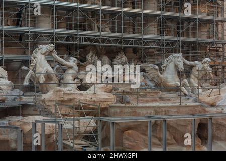 A vacation plan ruined when tourists discover one destination, the Trevi Fountain in Rome, Italy is under construction, covered in scaffolding. Stock Photo