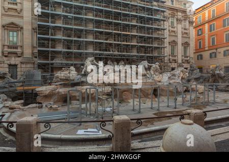 A vacation plan ruined when tourists discover one destination, the Trevi Fountain in Rome, Italy is under construction, covered in scaffolding. Stock Photo