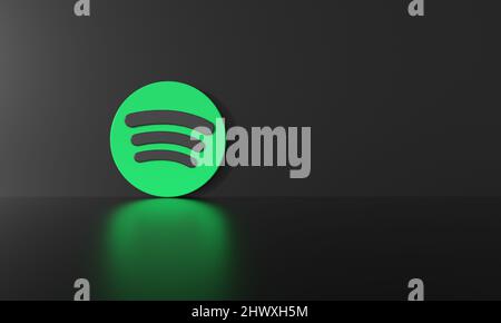 Spotify logo on black wall background and reflective floor with hard shadow and space for text and graphics. 3d Rendering. Stock Photo