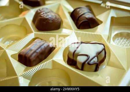 Various chocolates in an elegant chocolate box Stock Photo