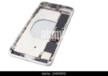 Disassembled smartphone on white background. Phone repair. Details of device. Body of broken device. Service maintenance of communicator. Internals of Stock Photo