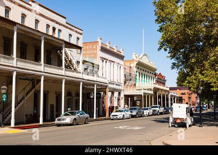 Old Sacramento, 2nd Street. old western buildings with cars parked. Stock Photo