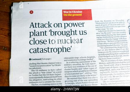 'Attack on power plant 'brought us close to nuclear catastrophe' in Russian Ukraine war Guardian newspaper headline article  5 March 2022 London UK Stock Photo