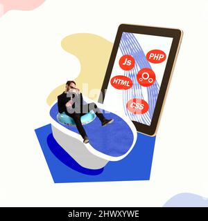 Creative design. Man in black suit resting with cocktail on bath near tablet screen, IT, programmer Stock Photo