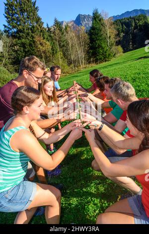 A group during a team-building exercise - teamwork ultimately brings ...