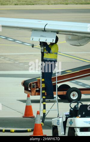 Passenger Jet getting refuelled, rising fuel prices, fuel crisis