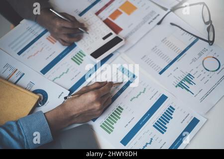 Group of Business people and Accountant checking data document on digital tablet for investigation of corruption account . Anti Bribery concept. Stock Photo