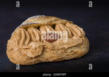 Photograph on a black background of a delicious Paris-Brest Stock Photo