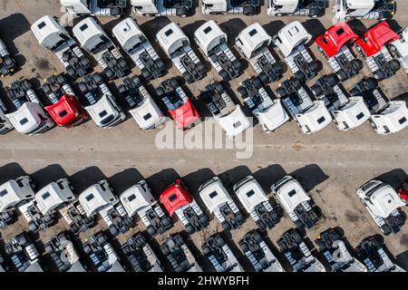Many trucks on parking lot aerial view, top down perspective Stock Photo