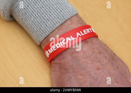 Red Silicone Medical Alert Bracelet Stock Photo