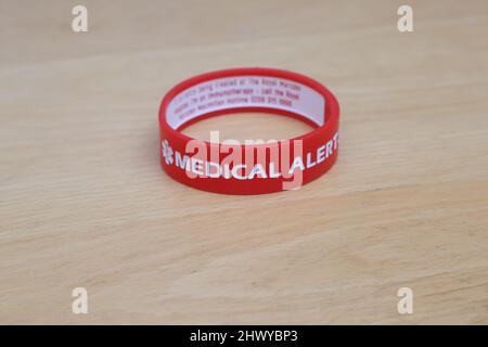 Red Silicone Medical Alert Bracelet Stock Photo