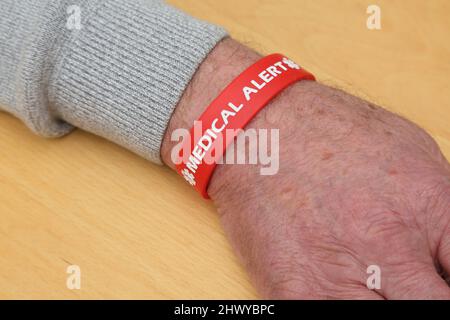 Red Silicone Medical Alert Bracelet Stock Photo