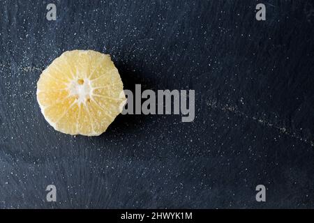 slice of citrus on black background Stock Photo