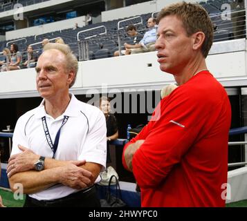 Arlington, USA. 19th Aug, 2011. In this file photo Former Dallas Cowboys quarterbacks Roger Staubach left, and Troy Aikman stands on the sidelines during Cowboys practice at Cowboys Stadium in Arlington, Texas, Friday, August 19, 2011. (Photo by Ron Jenkins/Fort Worth Star-Telegram/TNS/Sipa USA) Credit: Sipa USA/Alamy Live News Stock Photo