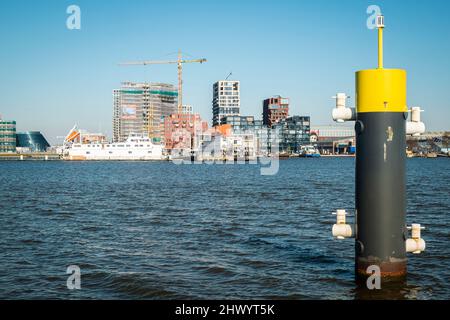 Ongoing redevelopment of the northern shore of the Ij waterway Amsterdam. Stock Photo