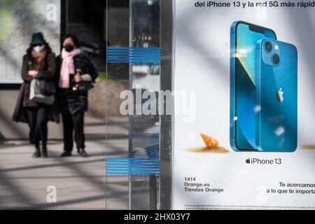 Madrid, Spain. 08th Mar, 2022. Pedestrians walk past an American multinational technology company Apple Iphone 13 Pro street commercial advertisement in Spain. (Photo by Xavi Lopez/SOPA Images/Sipa USA) Credit: Sipa USA/Alamy Live News Stock Photo