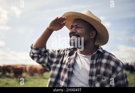 Putting in the work puts food on a table. Shot of a mature man working on a farm. Stock Photo