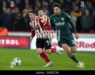 Sheffield, England, 8th March 2022.   John Fleck of Sheffield Utd  and Matt Crooks of Middlesbrough during the Sky Bet Championship match at Bramall Lane, Sheffield. Picture credit should read: Andrew Yates / Sportimage Stock Photo