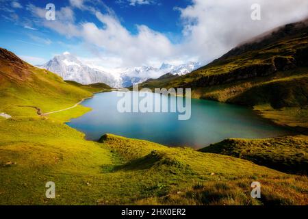 Great view of Mt. Schreckhorn and Wetterhorn above Bachalpsee lake. Dramatic and picturesque scene. Popular tourist attraction. Location Swiss alp, Be Stock Photo