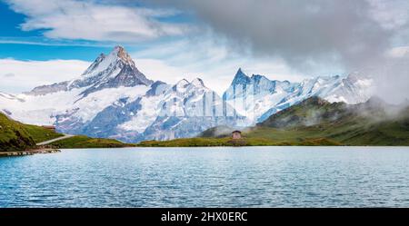 Great view of Mt. Schreckhorn and Wetterhorn above Bachalpsee lake. Dramatic and picturesque scene. Popular tourist attraction. Location Swiss alp, Be Stock Photo