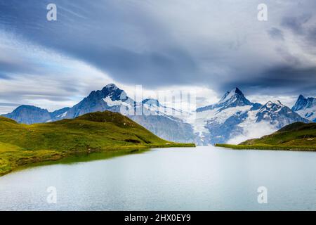 Great view of Mt. Schreckhorn and Wetterhorn above Bachalpsee lake. Dramatic and picturesque scene. Popular tourist attraction. Location Swiss alp, Be Stock Photo